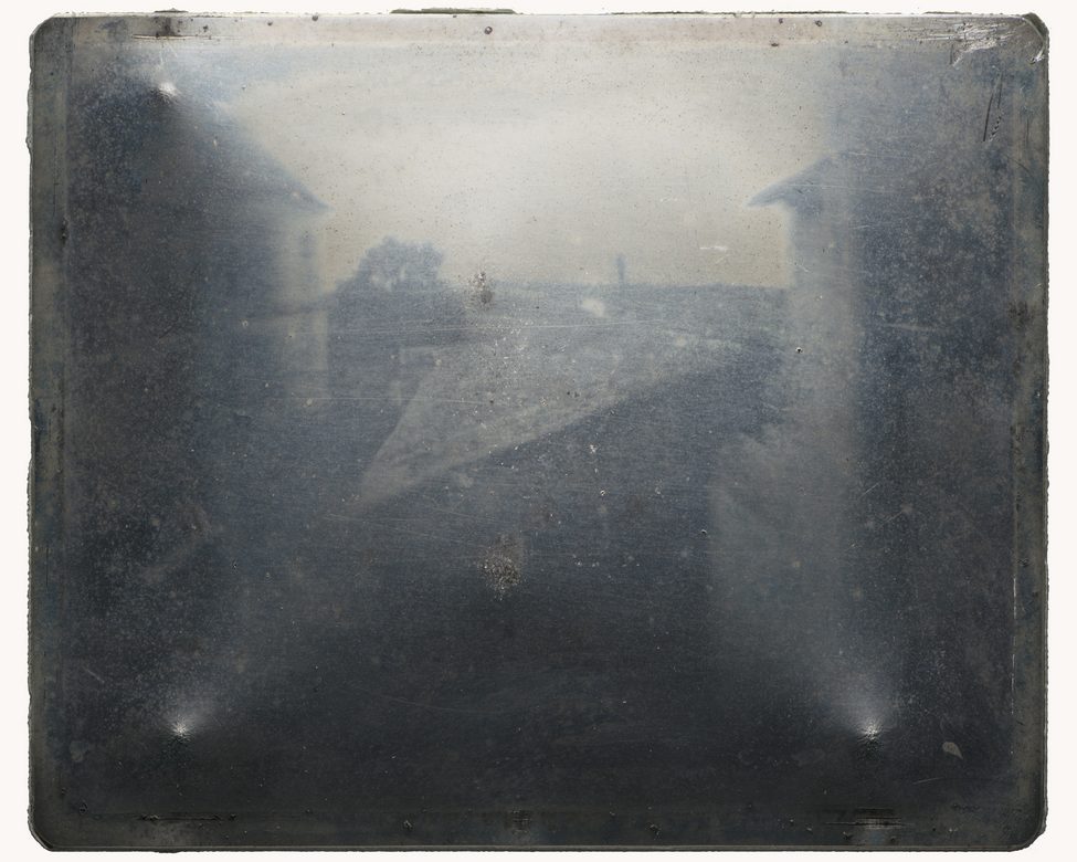 Joseph Nicéphore Niépce:  [1827] - Point de vue du Gras - first successful permanent photograph from nature - original photographic tin plate done with 8 hours exposure - The result was achieved by dissolving bitumen of Judea, a natural tar known since antiquity, in lavender oil, and spread a thin layer of this solution on a polished pewter plate - Harry Ransom Center, Texas